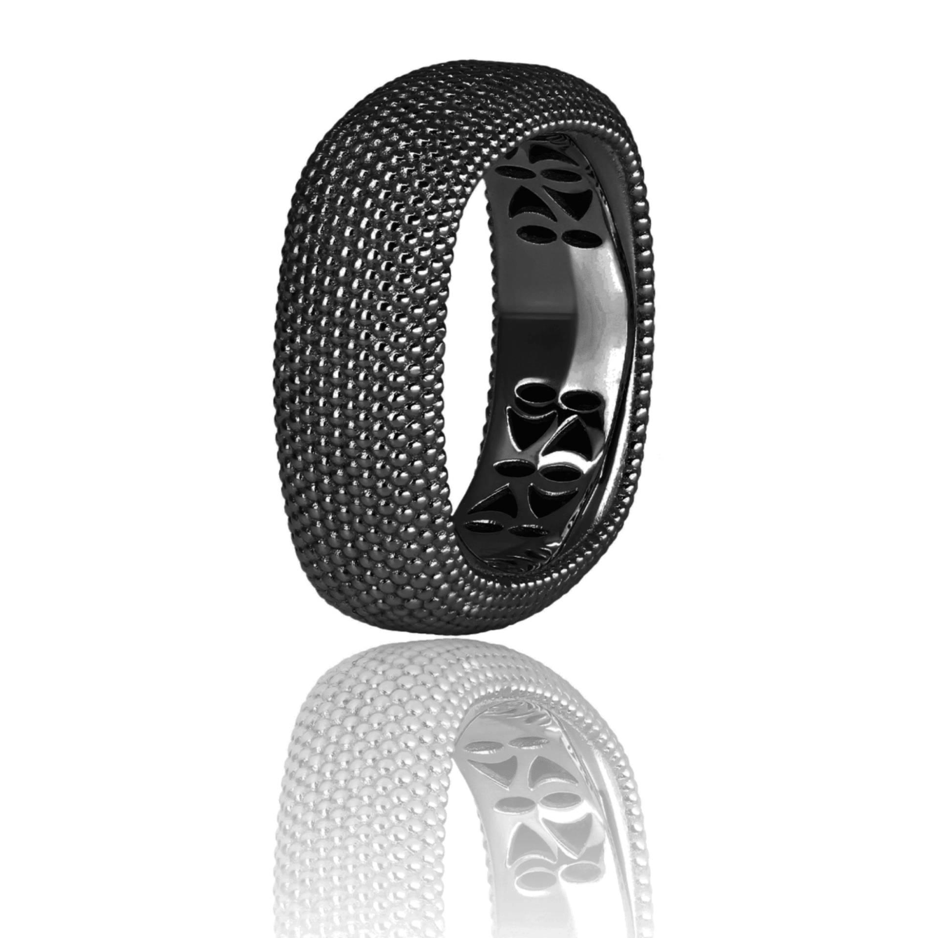 Bague noire texturée avec motifs ajourés